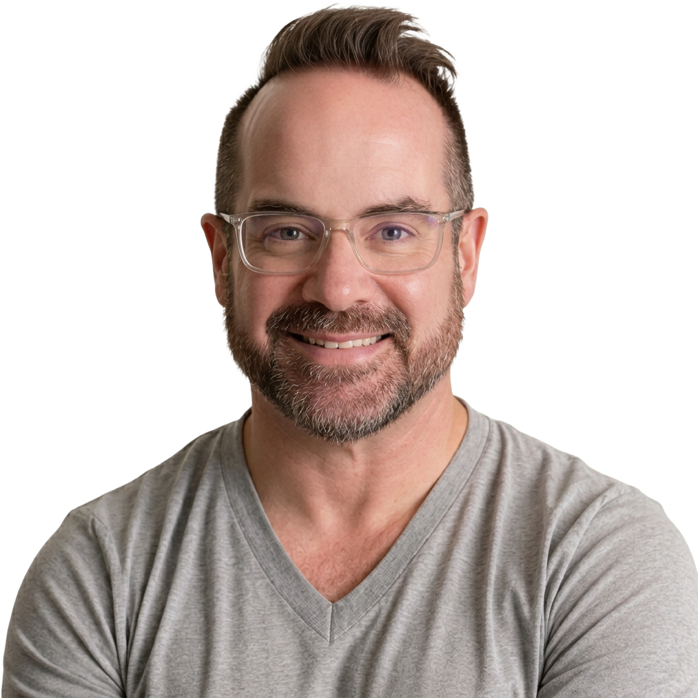 Michael McIntosh in a grey v-neck shirt